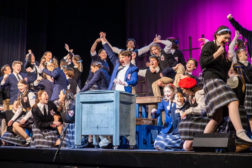 Students perform onstage